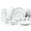 Set of white ceramic dinnerware including plates, bowls, and cups on a white background