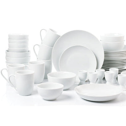 Set of white ceramic dinnerware including plates, bowls, and cups on a white background