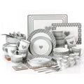 Gray and white ceramic dinnerware set with heart designs on a white background