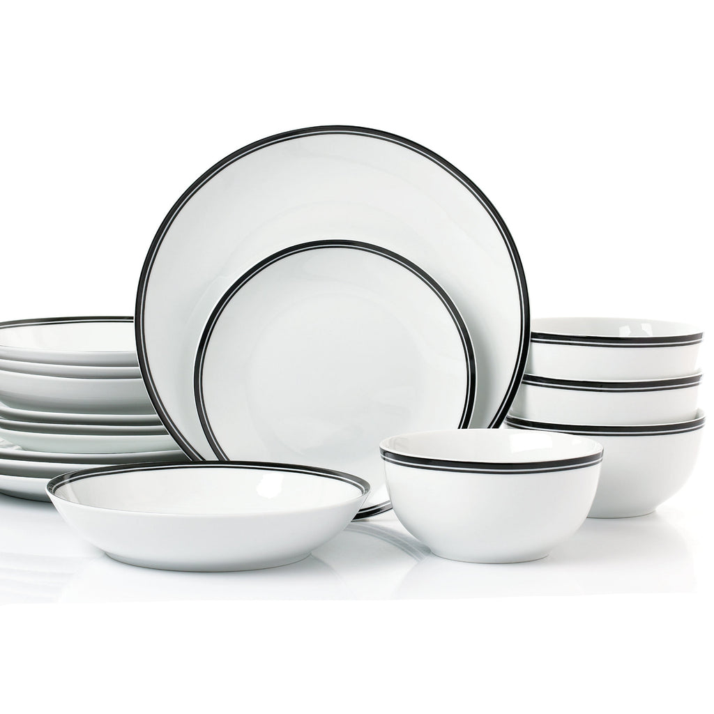 Set of white dinnerware with black rim on a white background