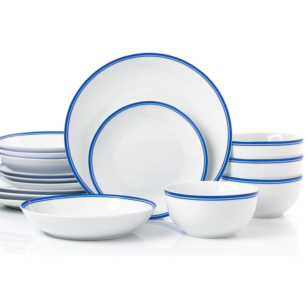 Set of white dinnerware with blue rims on a white background