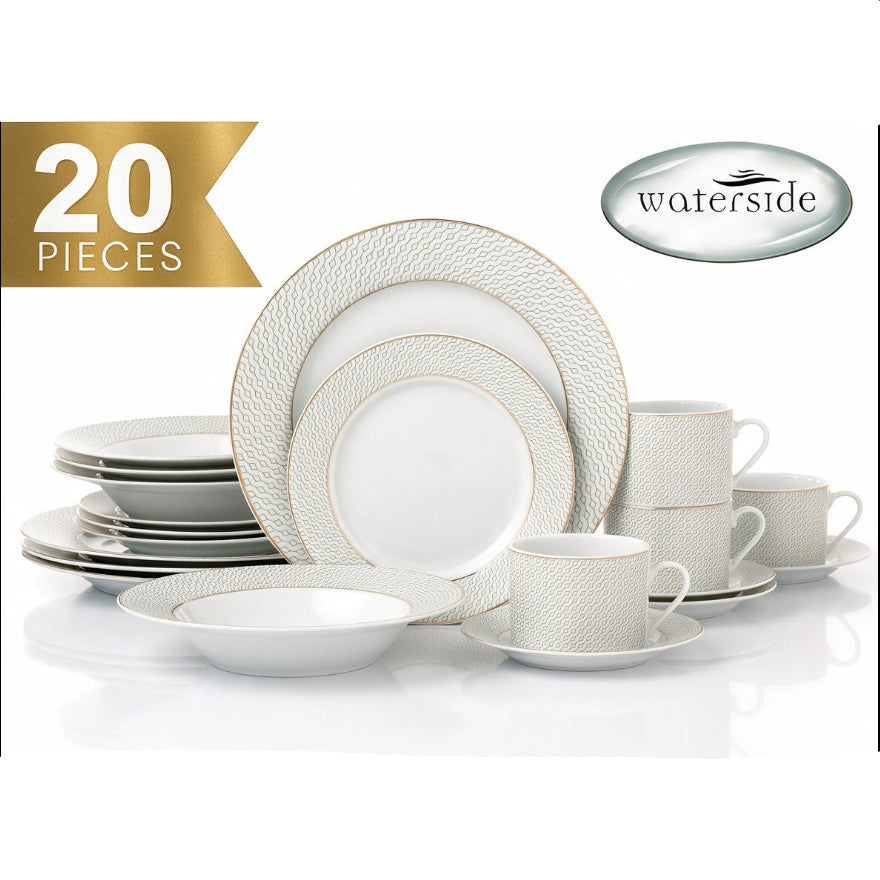 A 20-piece Waterside dinnerware set displayed on a reflective white surface, featuring textured white plates, bowls, cups, and saucers with gold trim. A gold banner in the top left reads '20 PIECES' and the Waterside brand logo is visible in the top right.