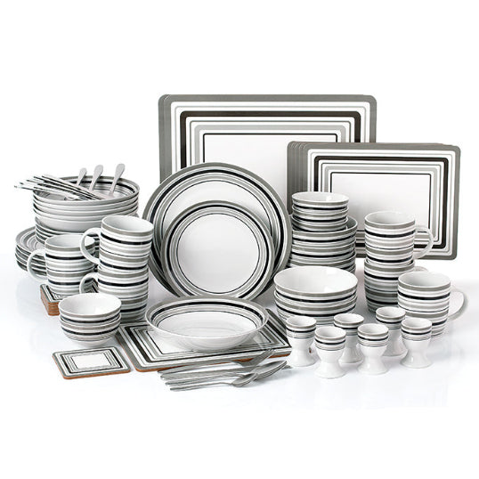 Dinnerware set with plates, bowls, and cutlery on a white background