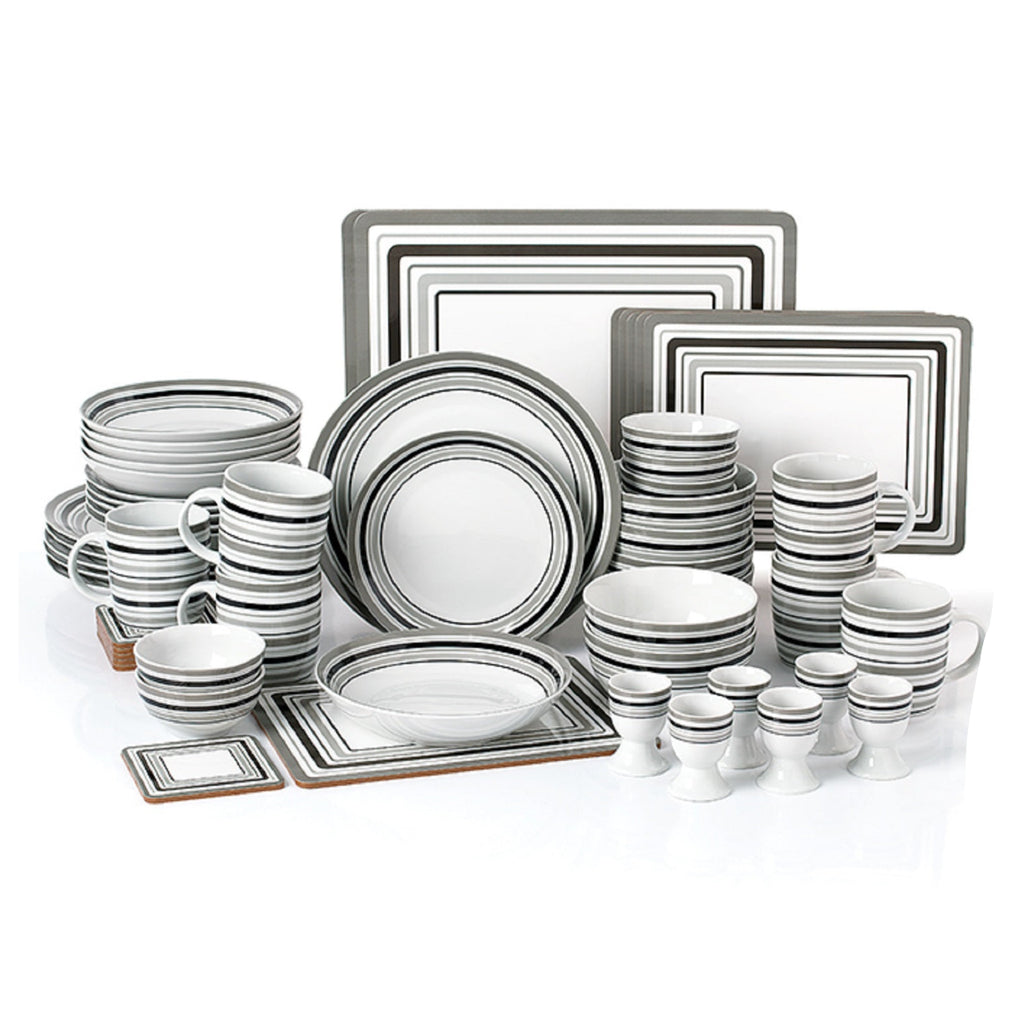Set of gray and white ceramic dinnerware on a white background