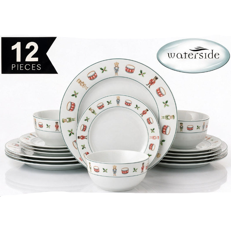A 12-piece Waterside dinnerware set featuring a white ceramic base with a festive holiday print of nutcrackers, drums, and holly leaves. The set includes plates, bowls, and cups, arranged on a reflective white surface with promotional text overlays.