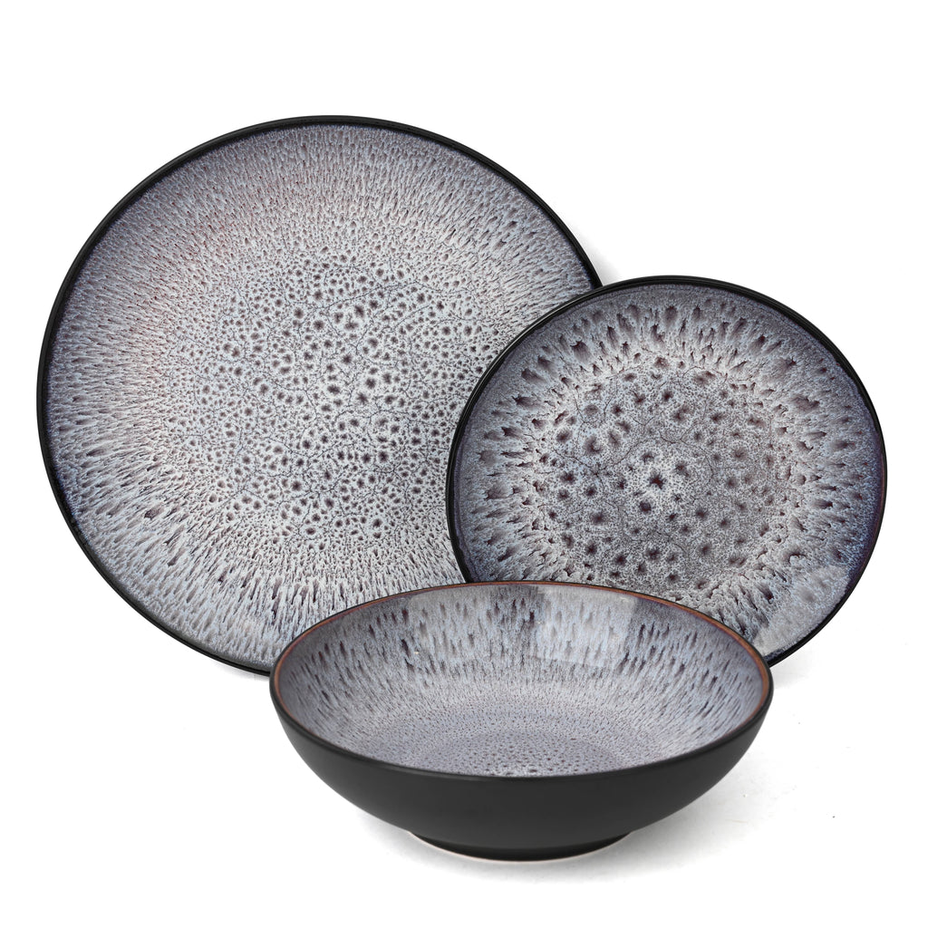 Set of ceramic plates with textured surface on a white background