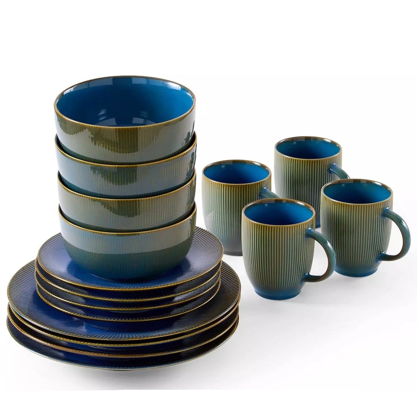 Set of blue and green ceramic dinnerware on a white background